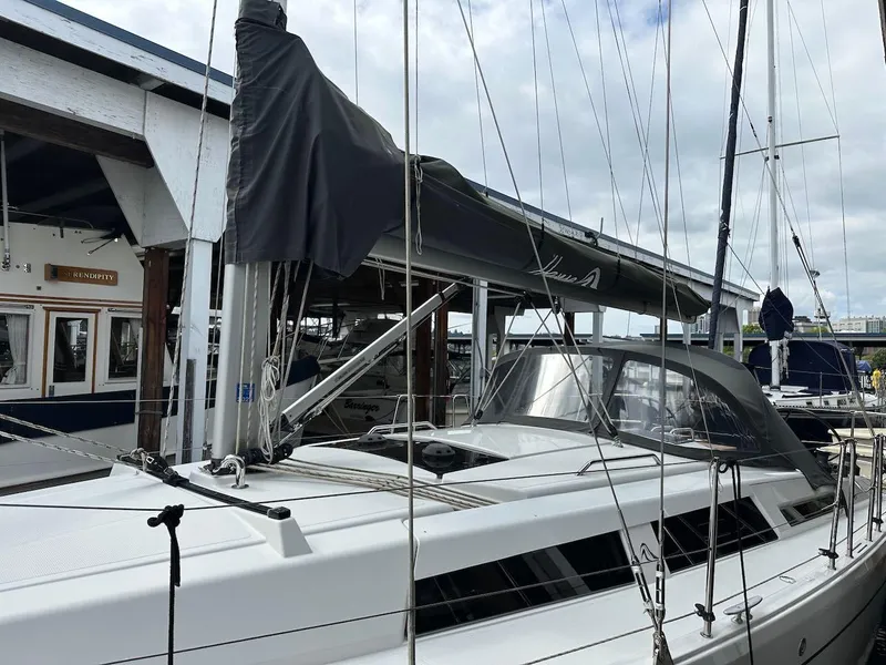 Slide: The Image of 2019 Hanse 348 sailboat docked at a marina, featuring sleek design and modern rigging. - 7