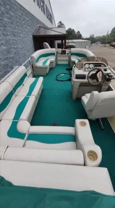 Slide: The Image of 2006 SunChaser 825F pontoon boat with spacious seating and teal accents. - 7