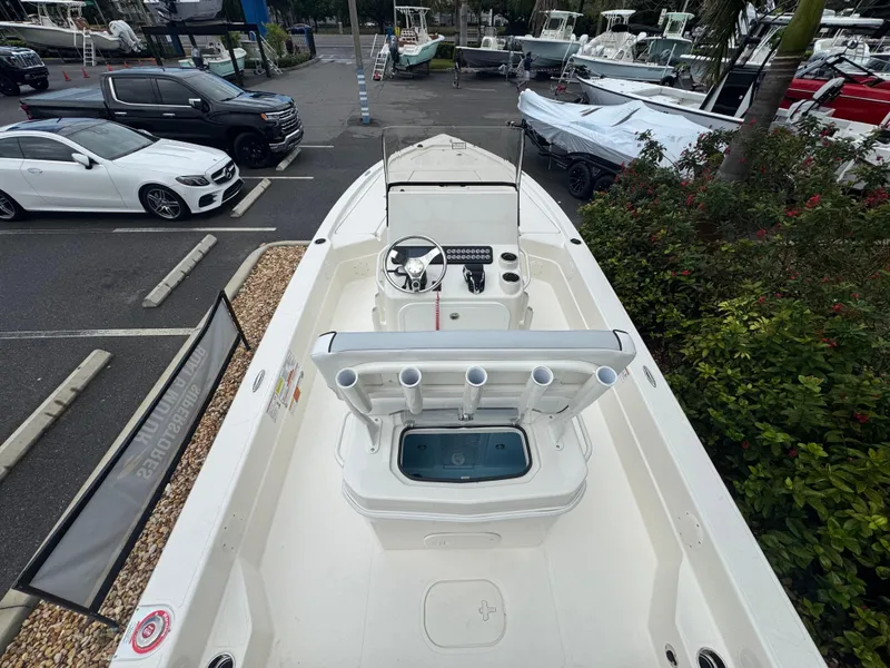 Slide: The Image of 2025 Skeeter SX 241 boat in a marina, showcasing sleek design and spacious deck. - 18