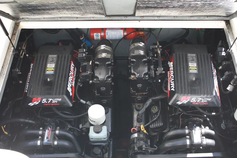 Slide: The Image of Twin Mercury engines in a 2000 Sea Ray 290 Sundancer boat. - 12