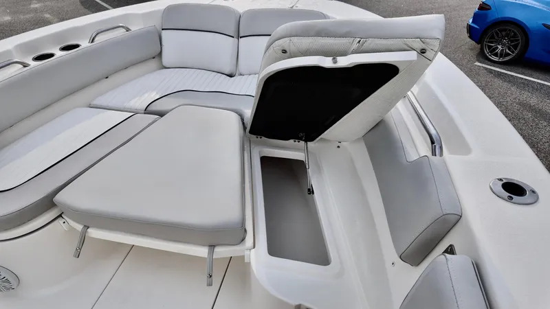 Slide: The Image of 2020 Sea Fox 248 Commander boat interior with open storage compartment and cushioned seating. - 10