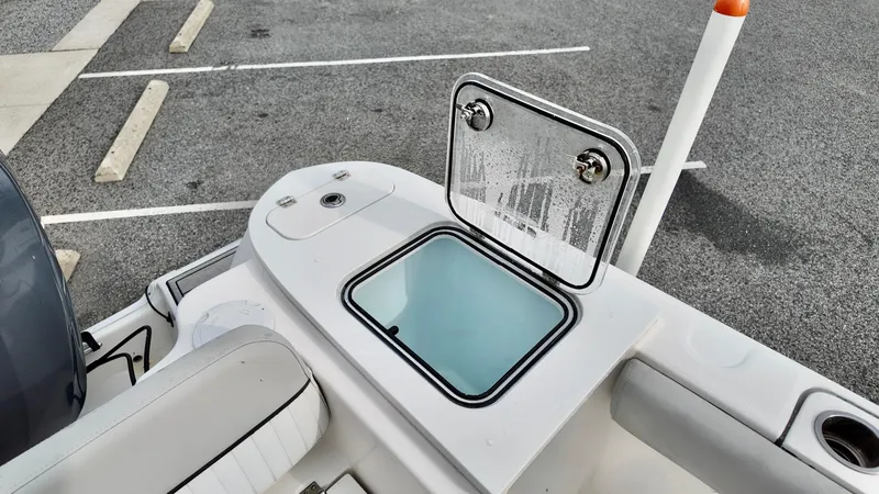 Slide: The Image of Open storage compartment on 2020 Sea Fox 248 Commander boat in parking lot. - 13
