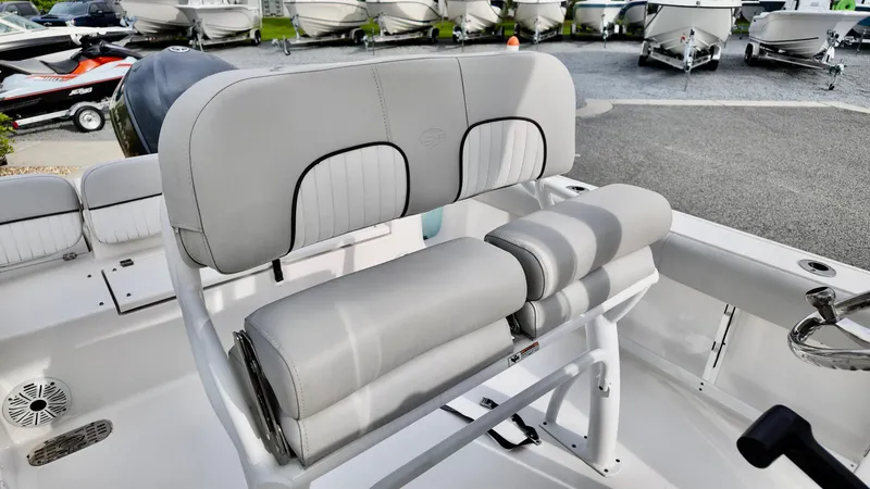 Slide: The Image of 2020 Sea Fox 248 Commander boat interior with cushioned seating and steering area. - 14