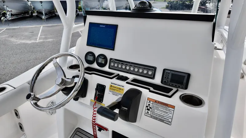 Slide: The Image of Control panel of 2020 Sea Fox 248 Commander boat with steering wheel and navigation instruments. - 15