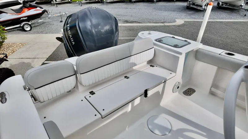 Slide: The Image of 2020 Sea Fox 248 Commander boat interior with seating and motor view. - 16