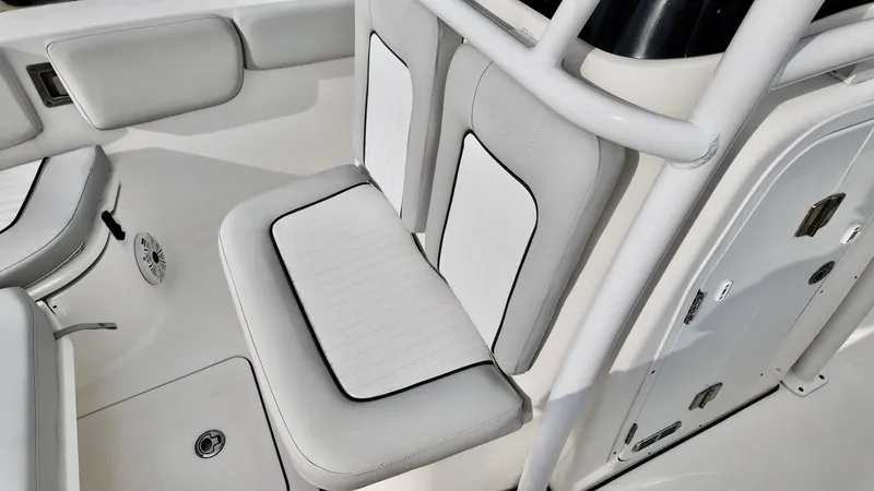 Slide: The Image of 2020 Sea Fox 248 Commander boat seating area with white and gray upholstery. - 17