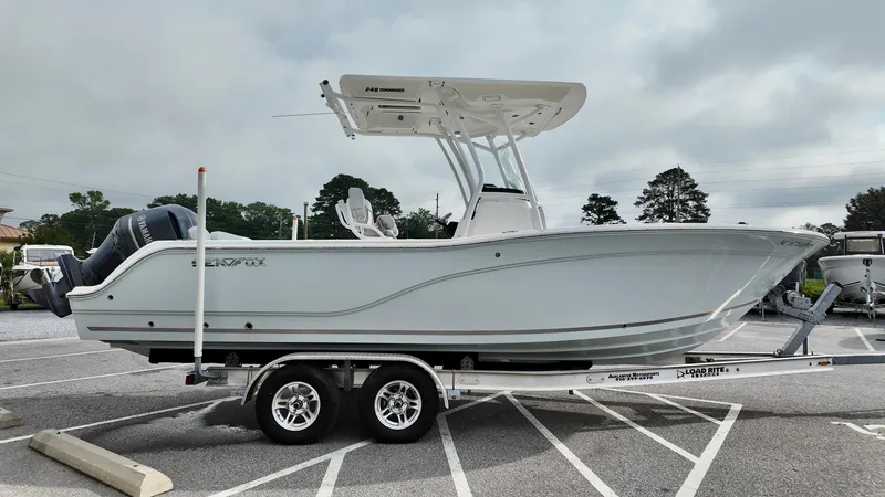 Slide: The Image of 2020 Sea Fox 248 Commander boat on trailer in parking lot, side view. - 2
