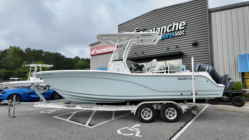 Slide: The Image of 2020 Sea Fox 248 Commander boat on trailer outside dealership. - 4