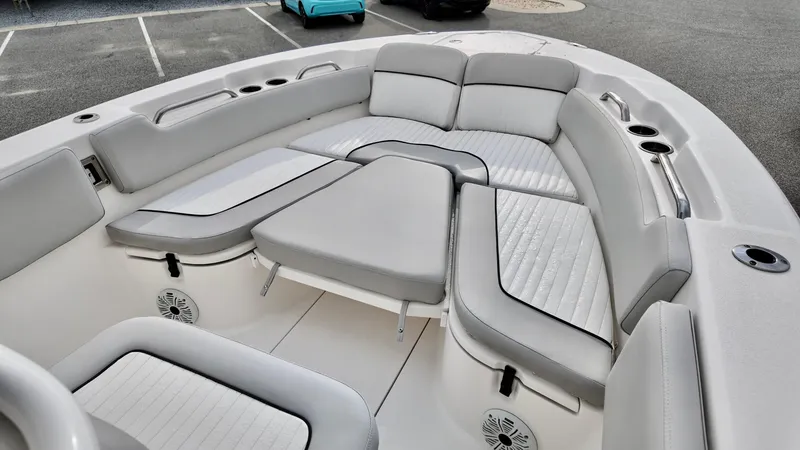 Slide: The Image of 2020 Sea Fox 248 Commander boat interior with cushioned seating and cup holders. - 5