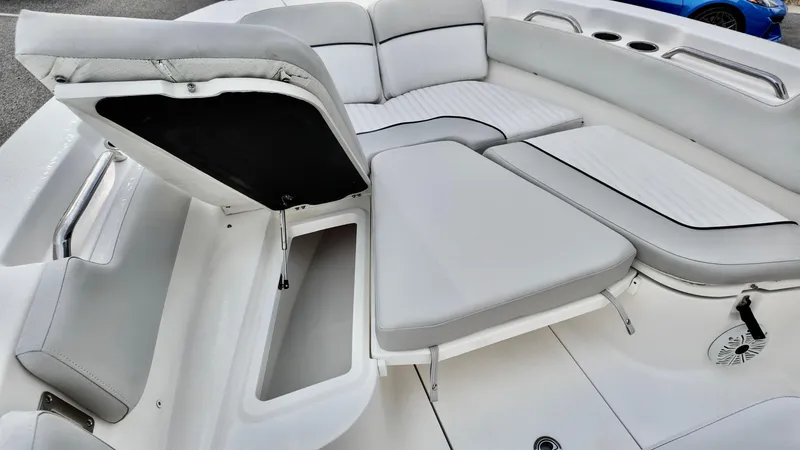 Slide: The Image of 2020 Sea Fox 248 Commander boat interior with open storage compartment and cushioned seating. - 9