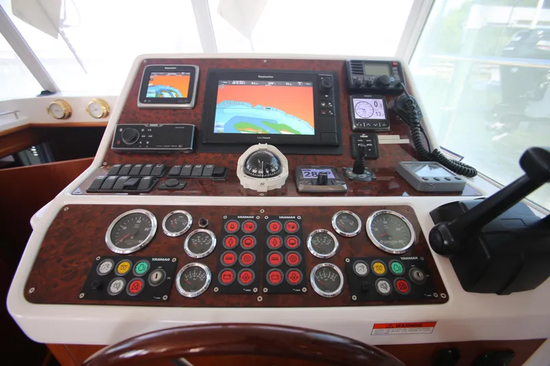 Slide: The Image of Control panel of a 2007 Beneteau Swift Trawler 42 with navigation instruments. - 17