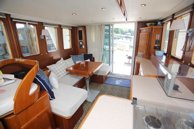 Slide: The Image of Interior of 2007 Beneteau Swift Trawler 42 with cozy seating and modern amenities. - 25