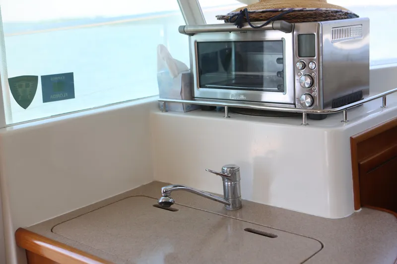 Slide: The Image of 2007 Beneteau Swift Trawler 42 kitchen with sink and countertop oven. - 27