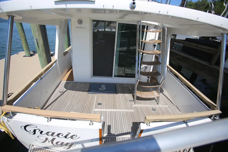 Slide: The Image of 2007 Beneteau Swift Trawler 42, rear deck view with spiral staircase and sliding doors. - 3