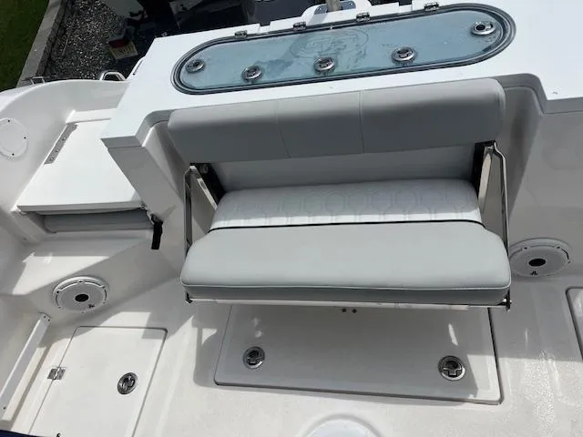 Slide: The Image of 2020 Sea Fox 288 Commander boat interior with cushioned seating and storage compartments. - 11