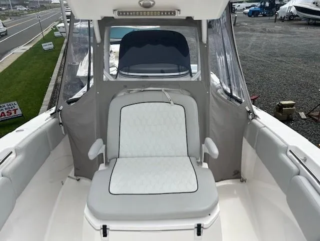 Slide: The Image of 2020 Sea Fox 288 Commander boat interior with cushioned seating and protective canopy. - 14