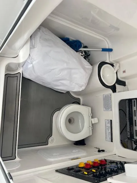 Slide: The Image of 2020 Sea Fox 288 Commander boat interior with toilet and storage area. - 19