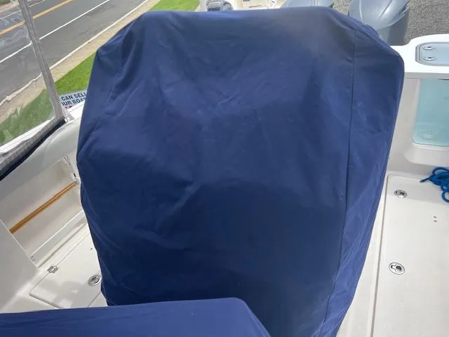 Slide: The Image of 2020 Sea Fox 288 Commander boat seat with blue protective cover. - 21