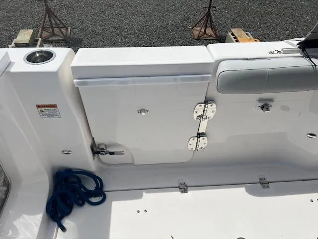 Slide: The Image of 2020 Sea Fox 288 Commander boat deck with storage compartment and blue rope. - 4