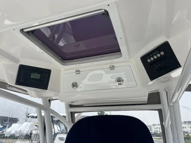 Slide: The Image of Interior view of 2020 Sea Fox 288 Commander boat console with controls and storage. - 7