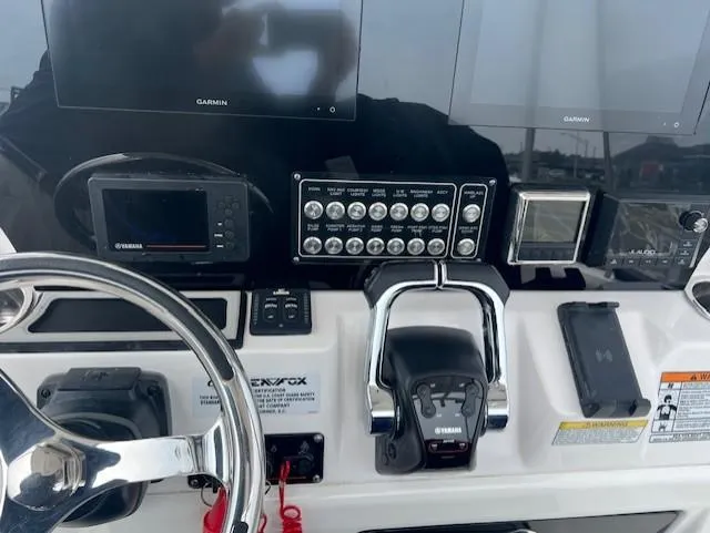 Slide: The Image of Control panel of 2020 Sea Fox 288 Commander boat with Garmin displays and Yamaha controls. - 8