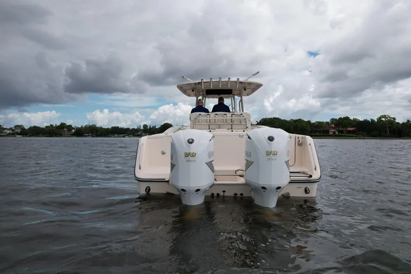 Slide: The Image of 2008 Grady-White Canyon 336 boat on water, rear view with dual engines. - 10