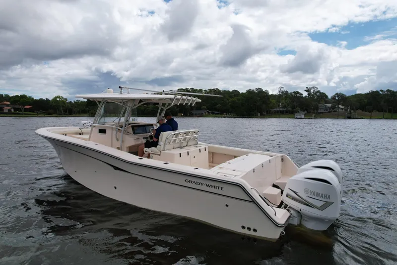 Slide: The Image of 2008 Grady-White Canyon 336 boat on a lake with Yamaha engines. - 7