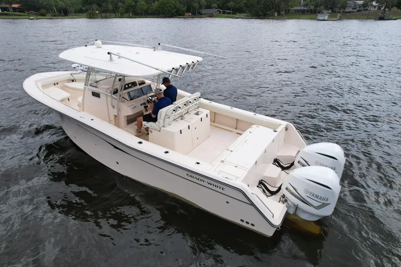 Slide: The Image of 2008 Grady-White Canyon 336 boat on water with dual Yamaha engines. - 8