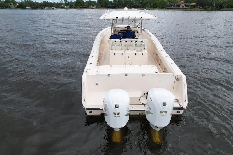 Slide: The Image of 2008 Grady-White Canyon 336 boat with dual engines on a calm lake. - 9