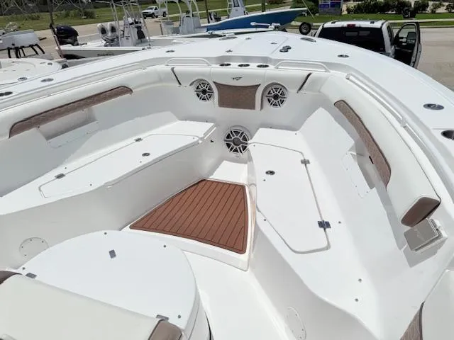 Slide: The Image of 2024 Tidewater 292 CC Adventure boat interior with seating and speakers. - 8