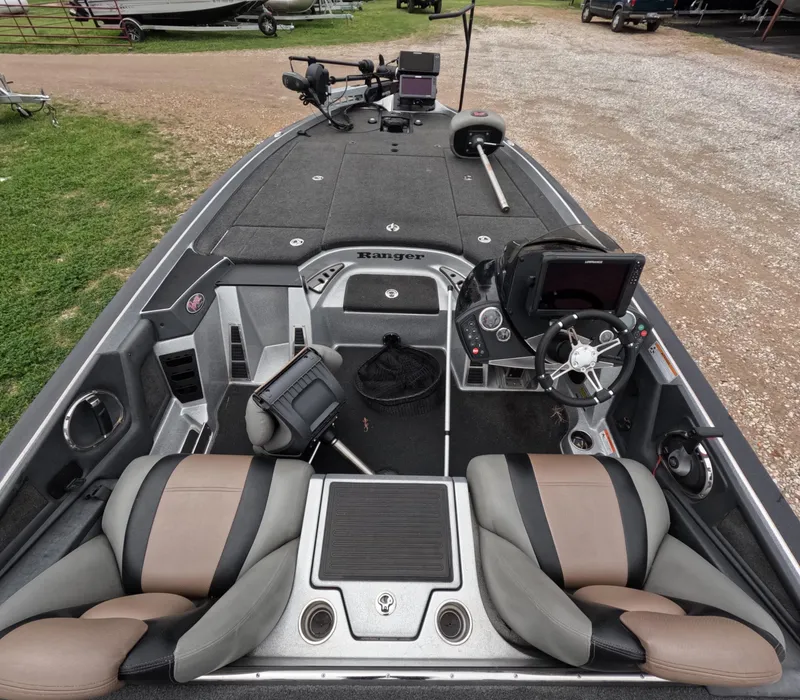 Slide: The Image of 2014 Ranger Z521C Comanche boat interior with dual seats and advanced navigation equipment. - 4