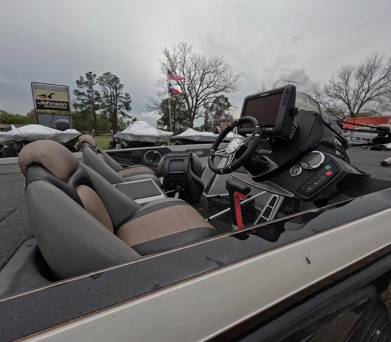 Slide: The Image of 2014 Ranger Z521C Comanche boat interior with steering wheel and seats. - 7