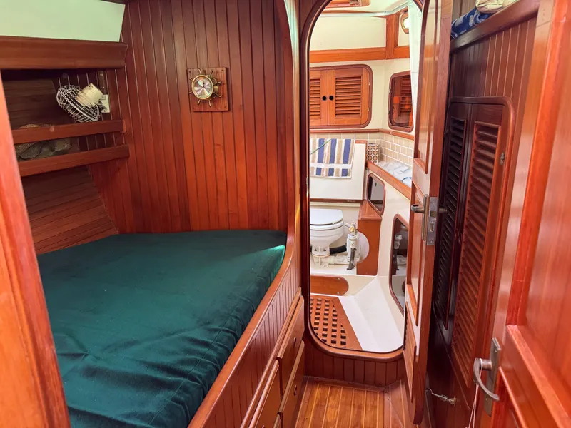 Slide: The Image of Interior of 1987 Hans Christian Christina 40 sailboat with wooden paneling and cozy cabin. - 15