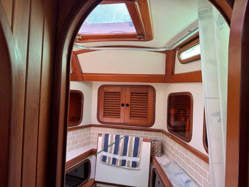 Slide: The Image of Interior of 1987 Hans Christian Christina 40 sailboat with wooden finishes and cozy cabin. - 18