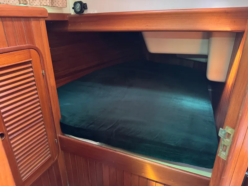 Slide: The Image of Cozy cabin interior of 1987 Hans Christian Christina 40 sailboat with wooden finish. - 4