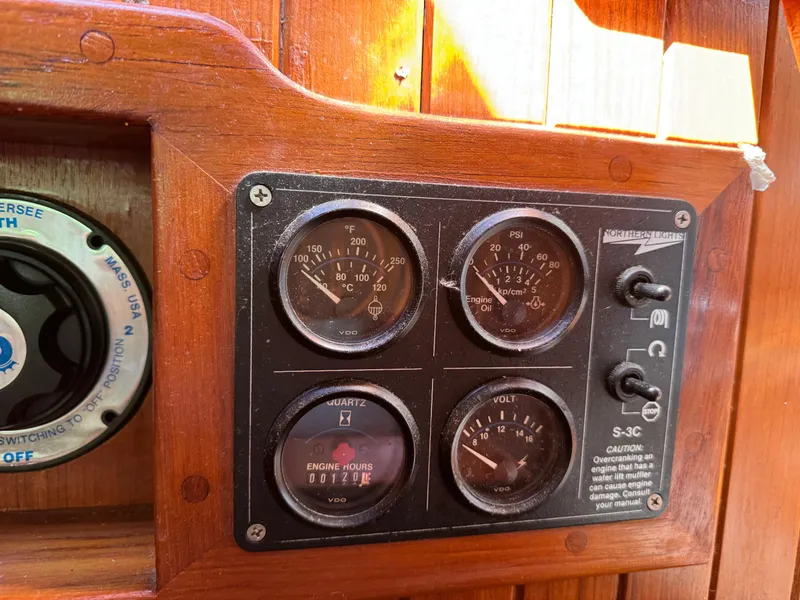 Slide: The Image of Control panel on a 1987 Hans Christian Christina 40 sailboat with gauges and switches. - 5