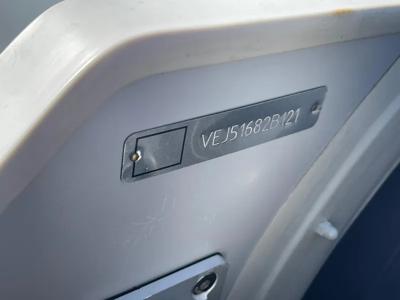 Slide: The Image of 2021 Saturn HD430 vehicle identification number (VIN) plate on a gray surface. - 4