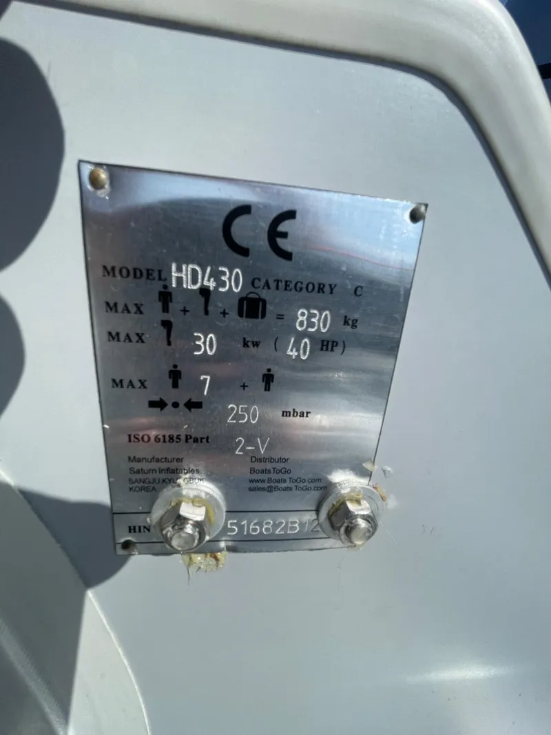 Slide: The Image of Metallic specification plate on Saturn HD430, 2021 model, displaying technical details and compliance information. - 9