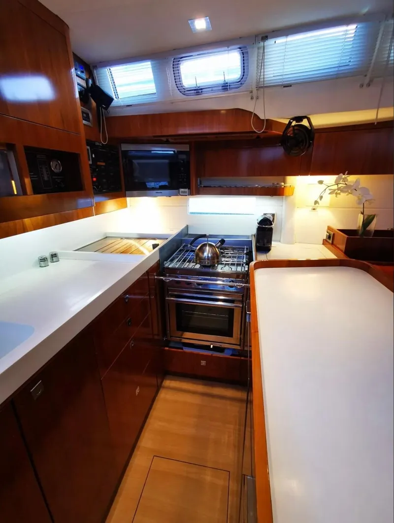 Slide: The Image of Modern kitchen in 2012 Amel 55 yacht with sleek countertops and stainless steel appliances. - 11
