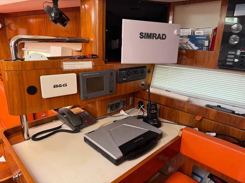 Slide: The Image of Navigation station on a 2012 Amel 55 yacht with Simrad and B&G equipment. - 15