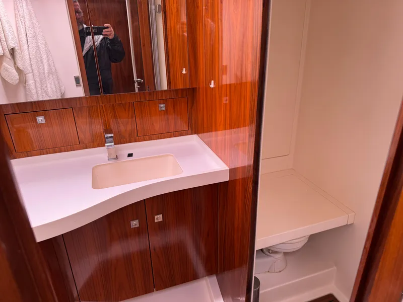 Slide: The Image of Luxurious bathroom in 2012 Amel 55 yacht with wooden cabinetry and modern fixtures. - 17