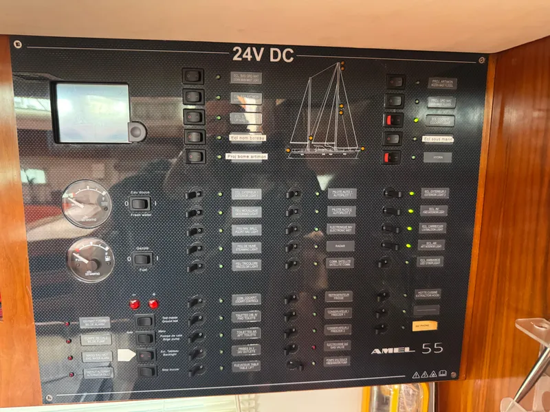 Slide: The Image of Electrical control panel of a 2012 Amel 55 yacht, featuring 24V DC system. - 22