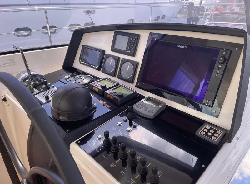 Slide: The Image of Control panel of a 2012 Amel 55 yacht with navigation instruments and displays. - 4