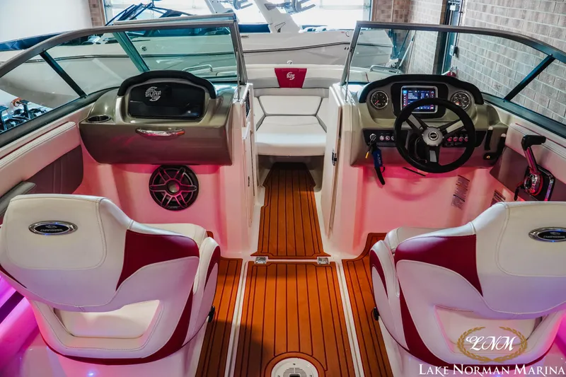 Slide: The Image of Interior of 2018 Chaparral 21 Surf boat with modern dashboard and seating. - 10