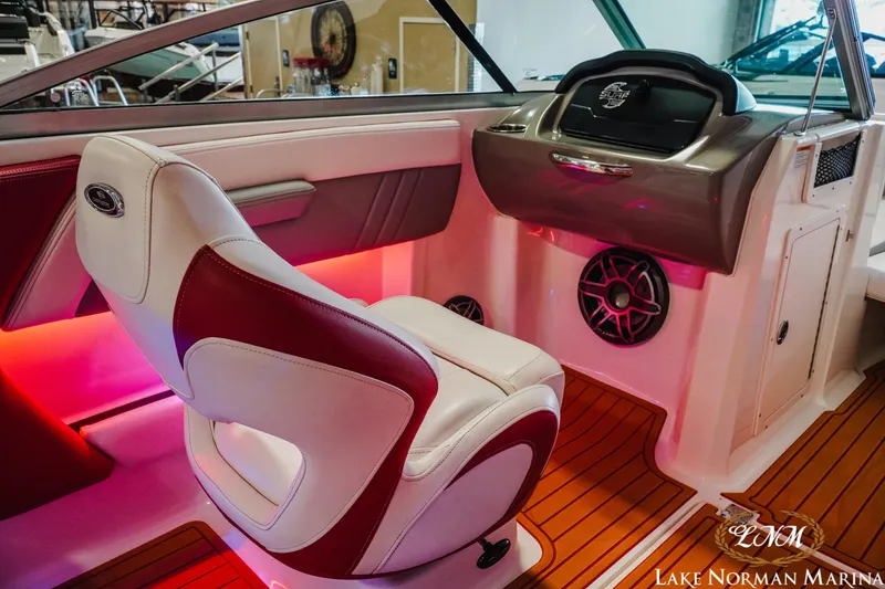 Slide: The Image of Interior of 2018 Chaparral 21 Surf boat with red accent lighting and stylish seating. - 13
