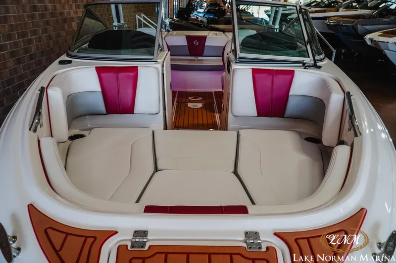 Slide: The Image of 2018 Chaparral 21 Surf boat interior with red and white seating at Lake Norman Marina. - 5
