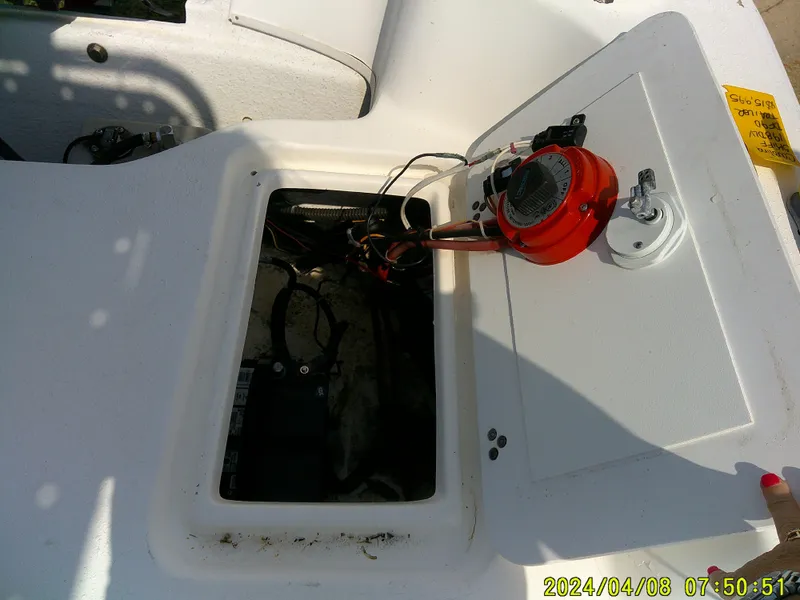 Slide: The Image of Open hatch of a 2010 Carolina Skiff 198 DLV boat showing internal components. - 14