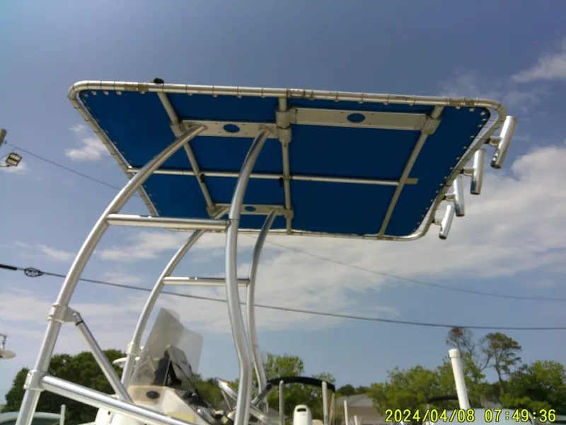 Slide: The Image of T-top canopy on a 2010 Carolina Skiff 198 DLV boat under a clear sky. - 5