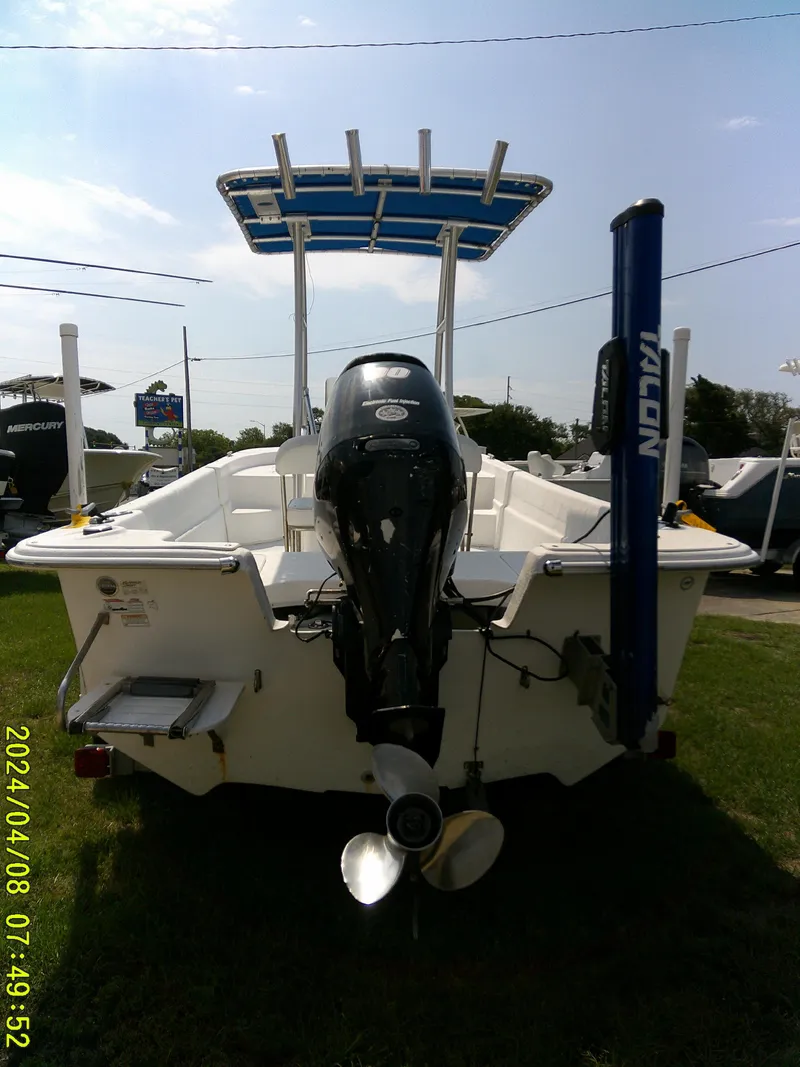 Slide: The Image of 2010 Carolina Skiff 198 DLV boat with outboard motor, rear view. - 7