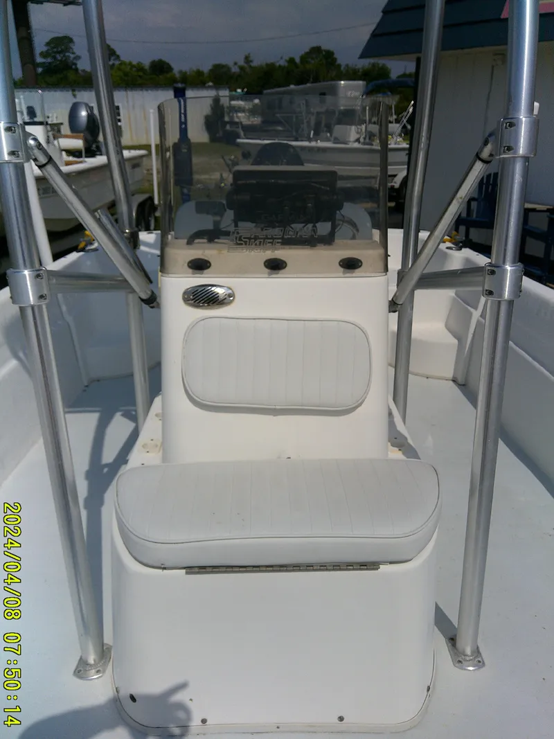Slide: The Image of 2010 Carolina Skiff 198 DLV boat interior with seating and console. - 9